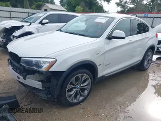 2015 BMW X4 xDrive28i with VIN 5UXXW3C51F0M86668, listed as a IAAI auction lot 42489071 with 59,694 mi miles and . Bid and sale history available at DreamBid. Image 18.