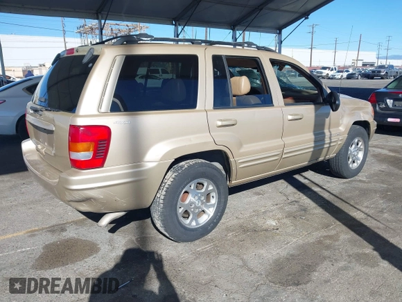 1999 Jeep Grand Cherokee Limited with VIN 1J4GW68NXXC727844, listed as a IAAI auction lot 41290773 with 222,838 mi miles. Bid and sale history available at carsss.com. Image 4.