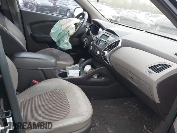 2011 Hyundai Tucson Limited with VIN KM8JUCACXBU293660, listed as a IAAI auction lot 42051931 with 99,995 mi miles and . Bid and sale history available at DreamBid. Image 5.