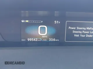 2021 Toyota Prius L Eco with VIN JTDKAMFU0M3149875, listed as a IAAI auction lot 41966010 with 99,542 mi miles. Bid and sale history available at carsss.com. Image 7.