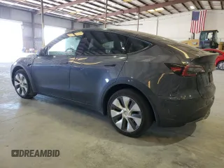 2023 Tesla Model Y Long Range z VIN 7SAYGDEE3PF862038, wystawiony jako Copart lot #57639325 z przebiegiem 11 020 mil mil oraz Szkoda całkowita • Salvage title. Historia ofert i sprzedaży dostępna na DreamBid. Obrazek 2.