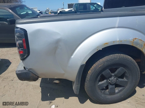 2011 Nissan Frontier PRO-4X with VIN 1N6AD0EVXBC407089, listed as a IAAI auction lot 42113537 with 124,853 mi miles. Bid and sale history available at carsss.com. Image 6.