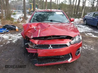 2016 Mitsubishi Lancer SE with VIN JA32V2FW7GU004159, listed as a IAAI auction lot 41401386 with 100,536 mi miles. Bid and sale history available at carsss.com. Image 11.