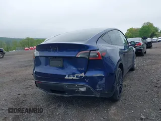 2023 Tesla Model Y Long Range z VIN 7SAYGDEE6PF603981, wystawiony jako IAAI lot #42133348 z przebiegiem 28 566 mil mil oraz . Historia ofert i sprzedaży dostępna na DreamBid. Obrazek 6.