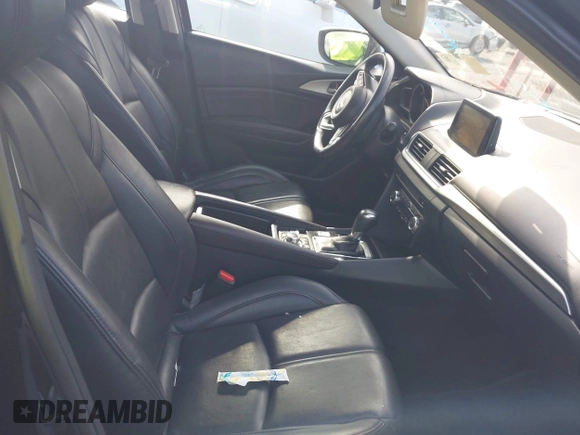 2017 Mazda 3 Touring z VIN 3MZBN1V74HM128575, wystawiony jako IAAI lot #42731487 z przebiegiem 136 553 mil mil oraz . Historia ofert i sprzedaży dostępna na DreamBid. Obrazek 5.