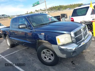 2005 Dodge Dakota SLT with VIN 1D7HE48K65S113812, listed as a IAAI auction lot 41612765 with 144,589 mi miles. Bid and sale history available at carsss.com. Image 1.