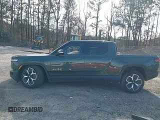 2022 Rivian R1T Adventure z VIN 7FCTGAAA8NN015369, wystawiony jako IAAI lot #41407842 z przebiegiem 22 507 mil mil oraz . Historia ofert i sprzedaży dostępna na DreamBid. Obrazek 14.