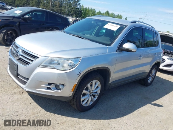 2011 Volkswagen Tiguan SE with VIN WVGBV7AX7BW529097, listed as a IAAI auction lot 42182690 with 139,878 mi miles and . Bid and sale history available at DreamBid. Image 2.