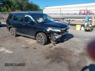 2019 Honda Pilot Touring 8-Passenger z VIN 5FNYF5H95KB019150, wystawiony jako IAAI lot #42173811 z przebiegiem 81 995 mil mil oraz . Historia ofert i sprzedaży dostępna na DreamBid. Obrazek 1.