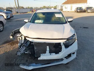 2019 Honda Civic LX with VIN 19XFC2F61KE014007, listed as a IAAI auction lot 41795070 with 64,259 mi miles and . Bid and sale history available at DreamBid. Image 12.