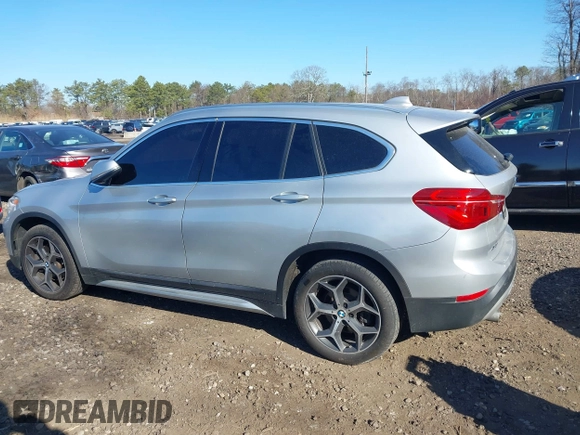2018 BMW X1 xDrive28i with VIN WBXHT3C30J5L29757, listed as a IAAI auction lot 41879504 with 60,490 mi miles. Bid and sale history available at carsss.com. Image 14.