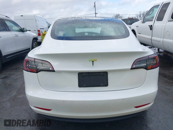 2020 Tesla Model 3 Standard Range Plus with VIN 5YJ3E1EA0LF741311, listed as a IAAI auction lot 41581931 with 43,284 mi miles. Bid and sale history available at carsss.com. Image 16.