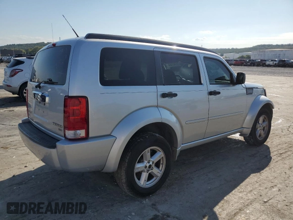 2011 Dodge Nitro SXT z VIN 1D4PT5GK5BW541154, wystawiony jako Copart lot #72741154 z przebiegiem 154 746 mil mil oraz Szkoda całkowita • Salvage title. Historia ofert i sprzedaży dostępna na DreamBid. Obrazek 3.