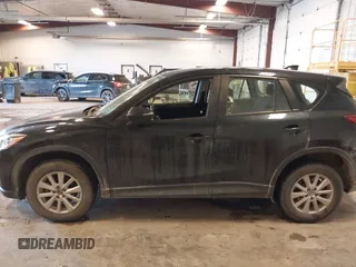 2015 Mazda CX-5 Sport with VIN JM3KE4BY0F0542655, listed as a IAAI auction lot 41471568 with 165,386 mi miles. Bid and sale history available at carsss.com. Image 14.