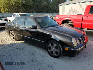 2002 Mercedes-Benz E-Class with VIN WDBJF65J32B494321, listed as a Copart auction lot 77557334 with 198,820 mi miles and Salvage Title. Bid and sale history available at carsss.com. Image 4.