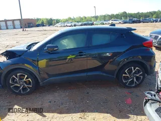 2019 Toyota C-HR XLE with VIN JTNKHMBX0K1023547, listed as a IAAI auction lot 41982484 with 119,533 mi miles and . Bid and sale history available at DreamBid. Image 14.
