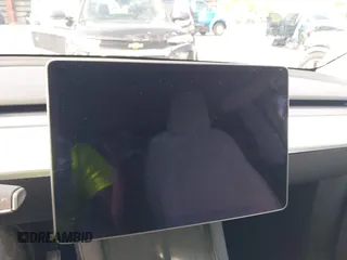 2025 Tesla Model Y Long Range z VIN 7SAYGDED0SF256650, wystawiony jako IAAI lot #41993206 z przebiegiem Nie podano mil oraz . Historia ofert i sprzedaży dostępna na DreamBid. Obrazek 15.