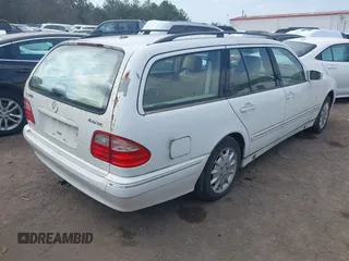 2001 Mercedes-Benz E-Class AWD with VIN WDBJH82J61X057506, listed as a IAAI auction lot 41506666 with 304,332 mi miles. Bid and sale history available at carsss.com. Image 4.
