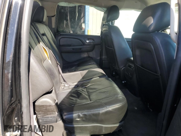 2014 Chevrolet Suburban LT with VIN 1GNSKJE71ER227075, listed as a Copart auction lot 76675654 with 214,113 mi miles and Salvage Title. Bid and sale history available at DreamBid. Image 11.