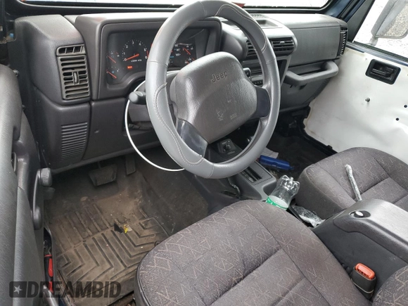 2001 Jeep Wrangler Sport with VIN 1J4FA49S01P363856, listed as a Copart auction lot 62494785 with 154,782 mi miles and Salvage title. Bid and sale history available at DreamBid. Image 8.