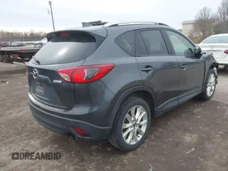 2014 Mazda CX-5 Grand Touring with VIN JM3KE4DY4E0343863, listed as a IAAI auction lot 41770402 with 117,615 mi miles. Bid and sale history available at carsss.com. Image 4.