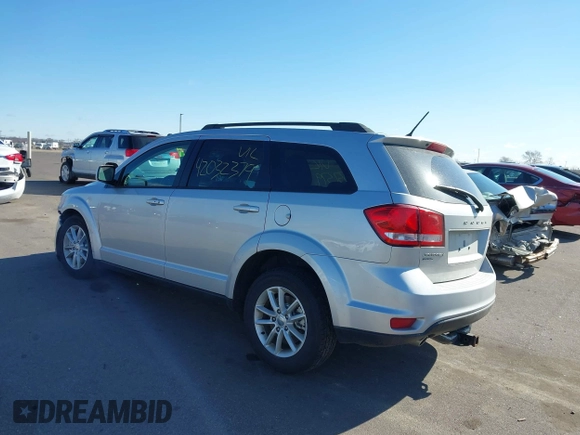 2013 Dodge Journey SXT with VIN 3C4PDDBG4DT506900, listed as a IAAI auction lot 42032379 with 130,911 mi miles and . Bid and sale history available at DreamBid. Image 3.