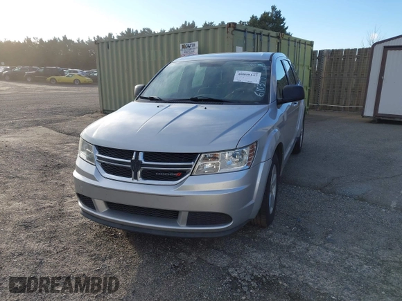 2013 Dodge Journey American Value with VIN 3C4PDCAB3DT610374, listed as a IAAI auction lot 40899147 with 133,386 mi miles and . Bid and sale history available at DreamBid. Image 2.