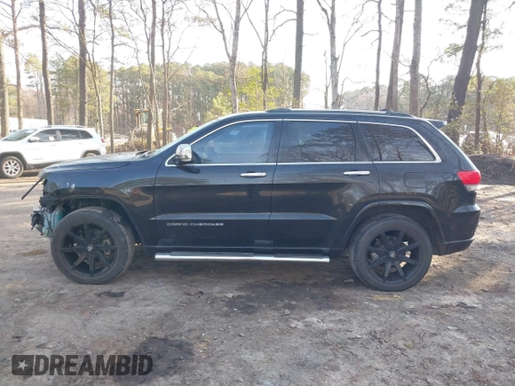 2015 Jeep Grand Cherokee Overland with VIN 1C4RJECGXFC957530, listed as a IAAI auction lot 41633522 with 168,258 mi miles and . Bid and sale history available at DreamBid. Image 14.