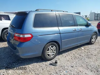2005 Honda Odyssey EX with VIN 5FNRL38465B059893, listed as a IAAI auction lot 42790058 with 257,143 mi miles and . Bid and sale history available at DreamBid. Image 4.