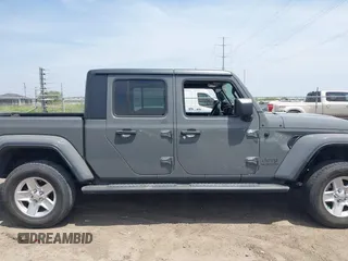 2021 Jeep Gladiator Sport S z VIN 1C6JJTAG9ML538769, wystawiony jako IAAI lot #42078142 z przebiegiem 49 924 mil mil oraz . Historia ofert i sprzedaży dostępna na DreamBid. Obrazek 13.