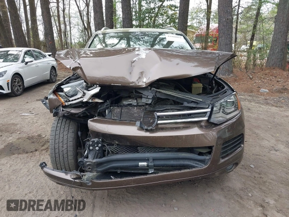 2014 Volkswagen Touareg Sport with VIN WVGEF9BP2ED007904, listed as a IAAI auction lot 41960811 with 126,230 mi miles and . Bid and sale history available at DreamBid. Image 12.
