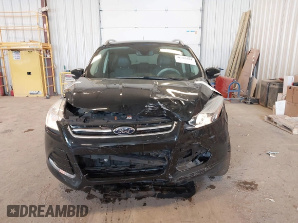 2016 Ford Escape Titanium with VIN 1FMCU0JX3GUB70607, listed as a IAAI auction lot 41727421 with 106,857 mi miles. Bid and sale history available at carsss.com. Image 13.