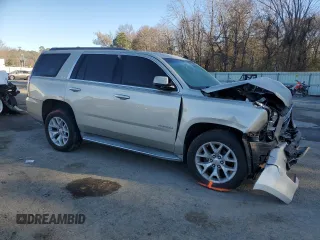 2015 GMC Yukon SLE with VIN 1GKS1AKC4FR265208, listed as a Copart auction lot 42324245 with 105,760 mi miles and Salvage Title. Bid and sale history available at carsss.com. Image 4.