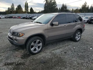 2006 BMW X5 4.4i with VIN 5UXFB53516LV27950, listed as a Copart auction lot 77837014 with 210,855 mi miles and Salvage Title. Bid and sale history available at carsss.com. Image 1.
