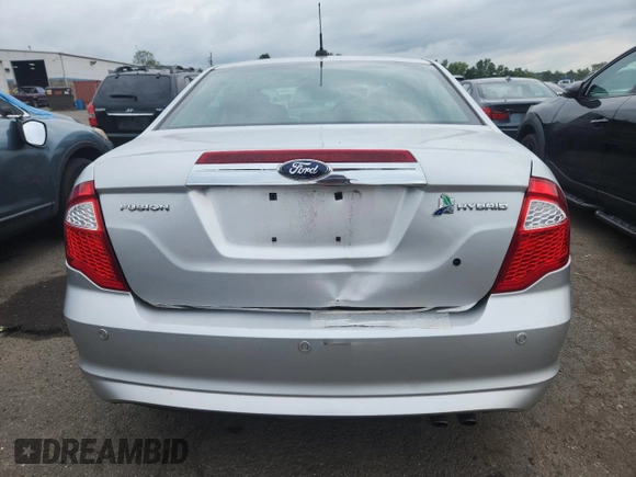 2012 Ford Fusion Hybrid z VIN 3FADP0L34CR227740, wystawiony jako Copart lot #64989475 z przebiegiem 134 862 mil mil oraz Szkoda całkowita • Salvage title. Historia ofert i sprzedaży dostępna na DreamBid. Obrazek 6.