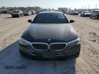 2018 BMW 5 Series 530i with VIN WBAJA5C54JG899845, listed as a Copart auction lot 76386124 with 57,379 mi miles and Salvage Title. Bid and sale history available at DreamBid. Image 5.