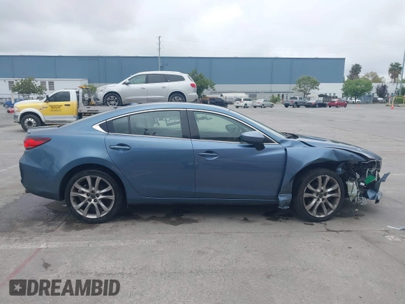 2014 Mazda 6 i Grand Touring with VIN JM1GJ1W64E1133729, listed as a IAAI auction lot 42050222 with 112,464 mi miles and . Bid and sale history available at DreamBid. Image 13.