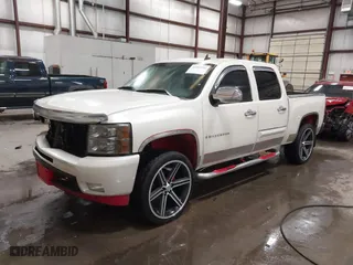 2009 Chevrolet Silverado 1500 LTZ with VIN 3GCEK33M39G177554, listed as a IAAI auction lot 41282566 with 142,356 mi miles. Bid and sale history available at carsss.com. Image 2.