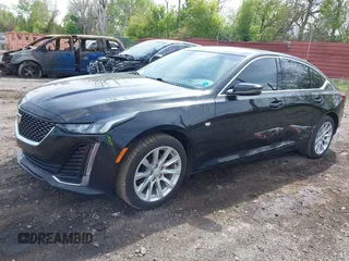 2021 Cadillac CT5 Luxury z VIN 1G6DX5RKXM0146235, wystawiony jako IAAI lot #42214676 z przebiegiem 72 847 mil mil oraz . Historia ofert i sprzedaży dostępna na DreamBid. Obrazek 2.