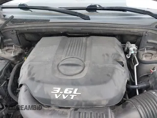 2014 Jeep Grand Cherokee Overland with VIN 1C4RJECG5EC207211, listed as a IAAI auction lot 41586309 with 115,293 mi miles. Bid and sale history available at carsss.com. Image 10.
