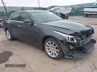 2015 Cadillac CTS AWD z VIN 1G6AW5SX6F0116891, wystawiony jako IAAI lot #42077259 z przebiegiem 119 426 mil mil oraz . Historia ofert i sprzedaży dostępna na DreamBid. Obrazek 1.