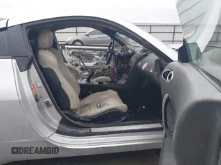 2003 Nissan 350Z Touring z VIN JN1AZ34E43T014247, wystawiony jako IAAI lot #42120812 z przebiegiem 112 263 mil mil oraz . Historia ofert i sprzedaży dostępna na DreamBid. Obrazek 5.
