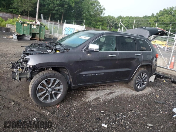2017 Jeep Grand Cherokee Overland with VIN 1C4RJFCG4HC730861, listed as a Copart auction lot 62918825 with 77,228 mi miles and Salvage title. Bid and sale history available at DreamBid. Image 1.