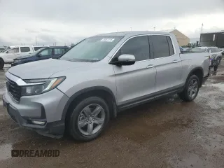 2022 Honda Ridgeline RTL-E with VIN 5FPYK3F78NB021309, listed as a Copart auction lot 55931215 with 64,904 mi miles and Salvage title. Bid and sale history available at DreamBid. Image 1.