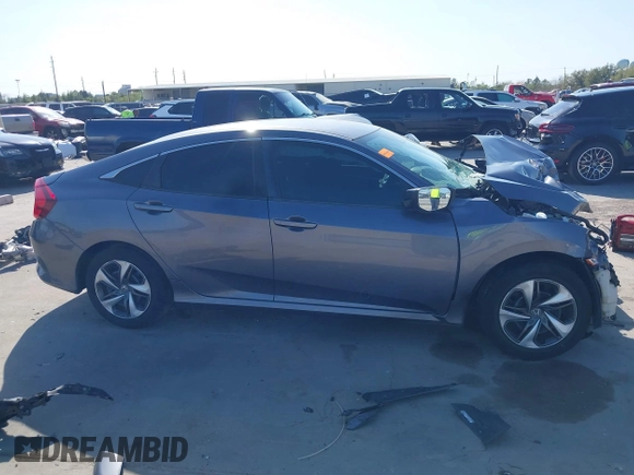 2020 Honda Civic LX z VIN 19XFC2F68LE023059, wystawiony jako IAAI lot #41856327 z przebiegiem 84 499 mil mil oraz . Historia ofert i sprzedaży dostępna na DreamBid. Obrazek 13.