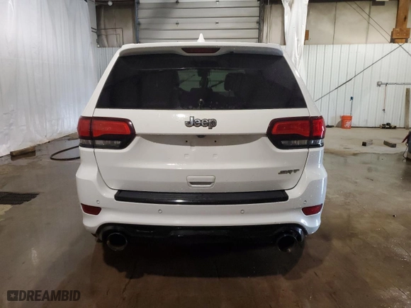 2015 Jeep Grand Cherokee SRT with VIN 1C4RJFDJ9FC237930, listed as a Copart auction lot 63540384 with 126,606 mi miles and Salvage Title. Bid and sale history available at carsss.com. Image 6.