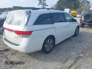 2014 Honda Odyssey Touring with VIN 5FNRL5H97EB127836, listed as a IAAI auction lot 41497413 with 174,914 mi miles and . Bid and sale history available at DreamBid. Image 4.