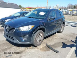 2016 Mazda CX-5 Touring with VIN JM3KE4CY0G0631786, listed as a IAAI auction lot 41761214 with 220,058 mi miles. Bid and sale history available at carsss.com. Image 20.