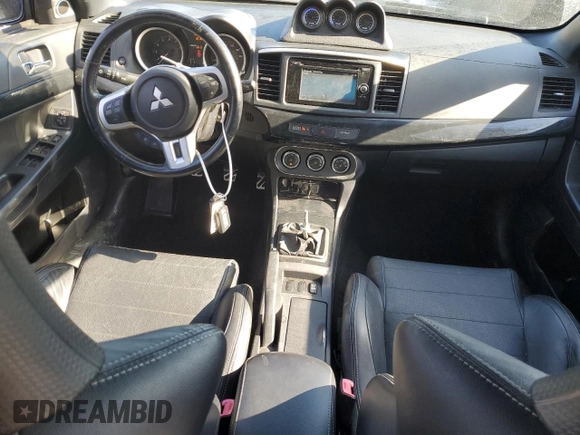 2014 Mitsubishi Lancer Evolution GSR z VIN JA32W8FV6EU010233, wystawiony jako Copart lot #42787275 z przebiegiem 74 780 mil mil oraz Szkody całkowita. Historia ofert i sprzedaży dostępna na DreamBid. Obrazek 8.