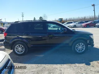 2016 Dodge Journey SXT with VIN 3C4PDCBGXGT123087, listed as a IAAI auction lot 41869667 with 256,583 mi miles. Bid and sale history available at carsss.com. Image 14.